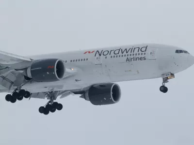 FILE PHOTO: A 777-200ER plane owned by Russia's Nordwind Airlines descends before landing and completing a direct flight from the Venezuelan capital of Caracas at Vnukovo International Airport outside Moscow, Russia January 31, 2019. REUTERS/Tatyana Makeyeva/File Photo
