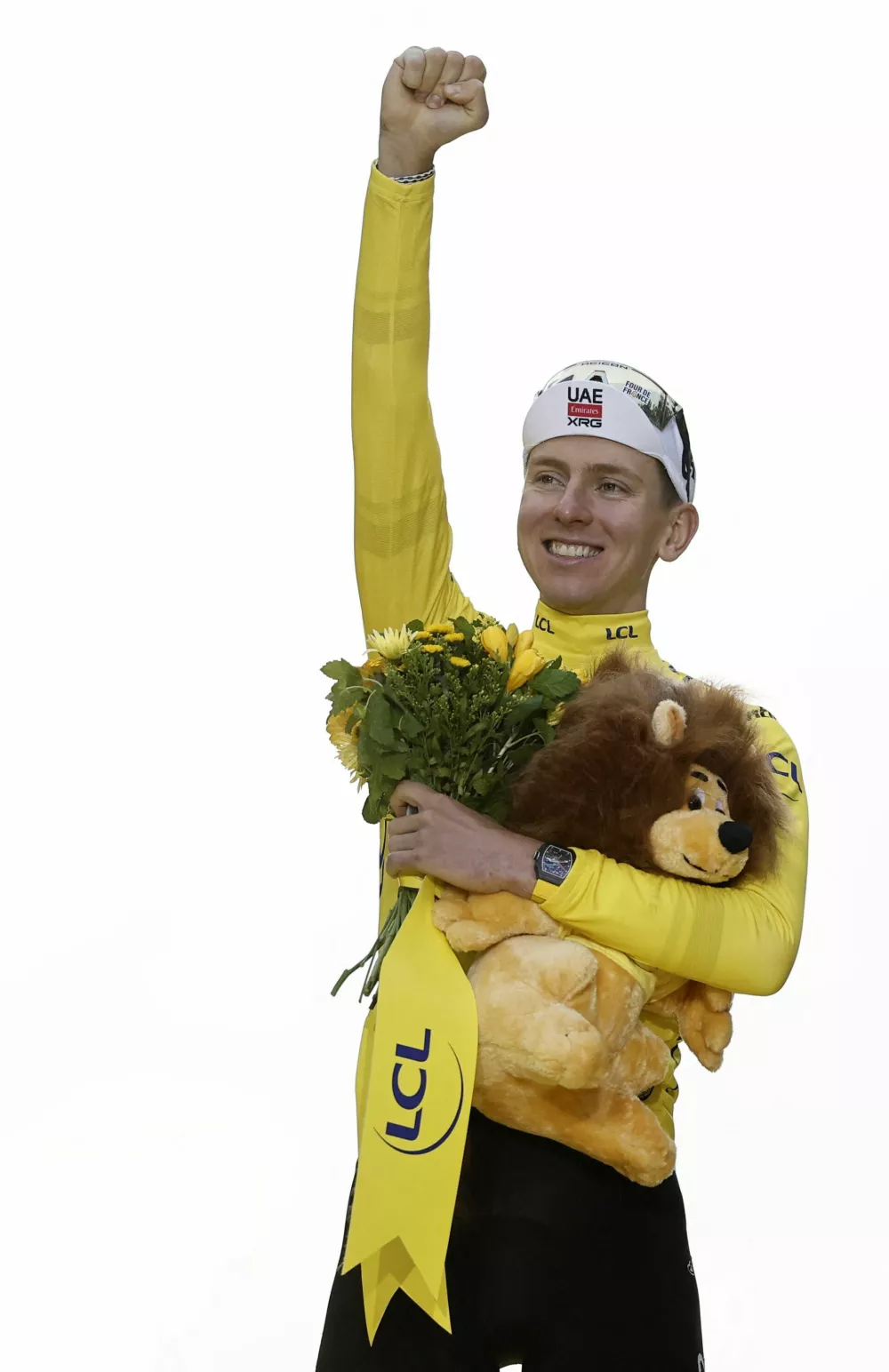 Cycling - Tour de France - Stage 21 - Mantes-la-Ville to Paris - Paris, France - July 27, 2025 UAE Team Emirates XRG's Tadej Pogacar celebrates on the podium while wearing the yellow jersey and winning the Tour de France REUTERS/Benoit Tessier