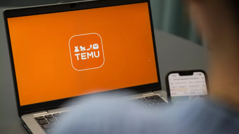 FILED - 29 August 2023, Berlin: View of a laptop with the Temu app logo (staged scene). Chinese online retail giant Temu violates European Union laws by not doing enough to tackle the sale of illegal products on the shopping platform, according to the preliminary findings of a probe carried out by the European Commission. Photo: Hannes P Albert/dpa