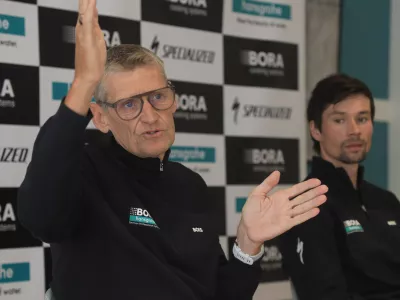 FILED - 10 January 2024, Spain, Palma: Red Bull-Bora-hansgrohe sporting leader Rolf Aldag (L) and Primoz Roglic takes part in the Bora-hansgrohe team presentation in Palma. Photo: Clara Margais/dpa