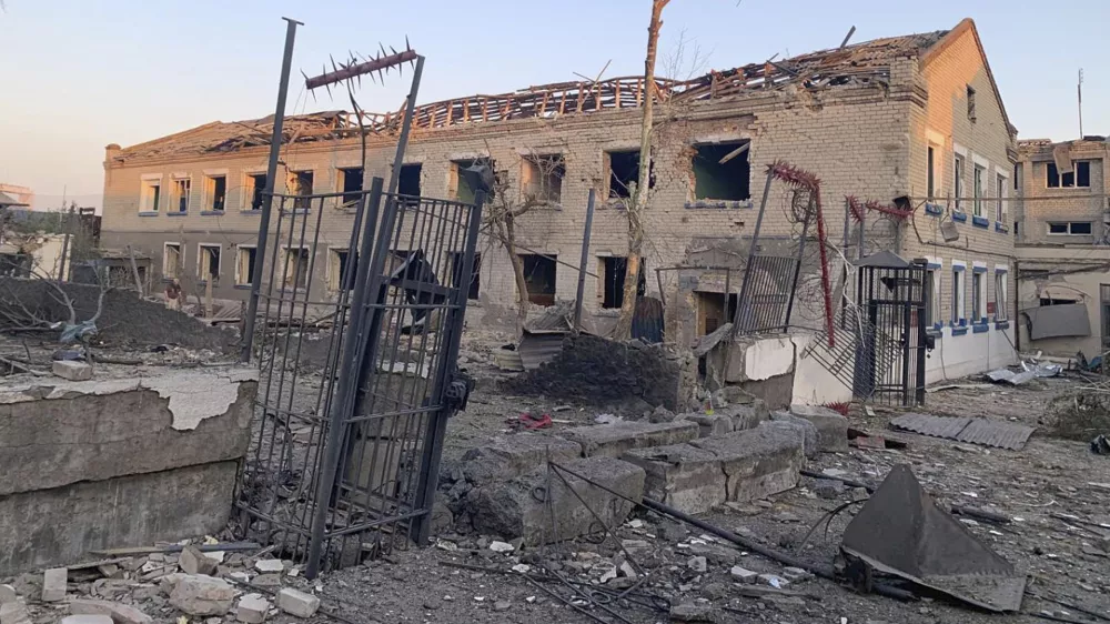 This photo provided by Ukraine's State Criminal Executive Service shows a damaged prison in the village of Bilenke in Ukraine's Zaporizhzhia region, following a Russian bomb attack that killed at least 17 inmates, on Tuesday, July 29, 2025. (Ukraine's State Criminal Executive Service via AP)
