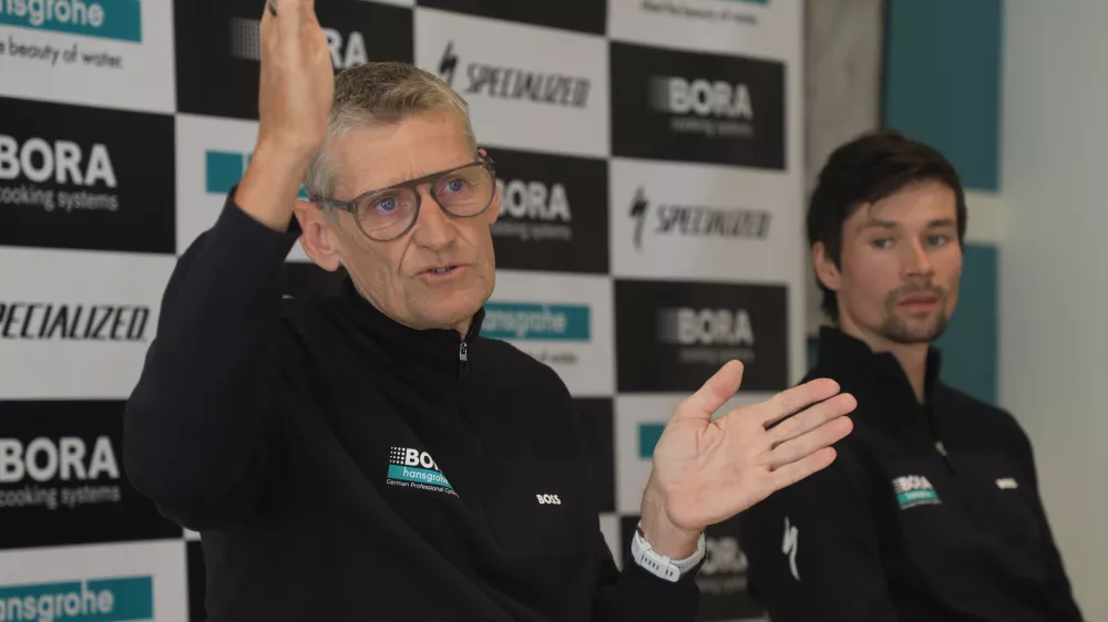 FILED - 10 January 2024, Spain, Palma: Red Bull-Bora-hansgrohe sporting leader Rolf Aldag (L) and Primoz Roglic takes part in the Bora-hansgrohe team presentation in Palma. Photo: Clara Margais/dpa