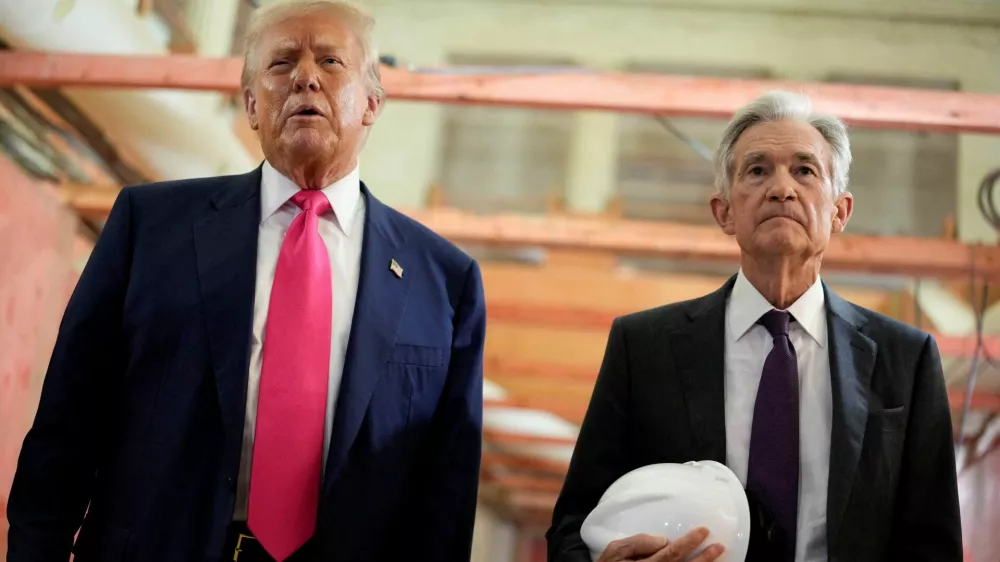 FILE PHOTO: U.S. President Donald Trump and Federal Reserve Chair Jerome Powell speak during a tour of the Federal Reserve Board building, which is currently undergoing renovations, in Washington, D.C., U.S., July 24, 2025. REUTERS/Kent Nishimura/File Photo