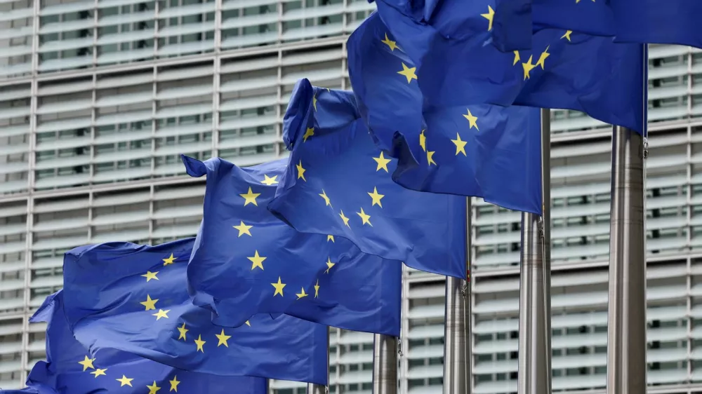 FILE PHOTO: European Union flags flutter outside the EU Commission headquarters in Brussels, Belgium July 16, 2025. REUTERS/Yves Herman/File Photo