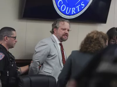 Dentist James Craig is lead away after verdict rendered in his murder trial in district court in in Arapahoe County, Wednesday, July 30, 2025, in Centennial, Colo. (AP Photo/David Zalubowski, Pool)