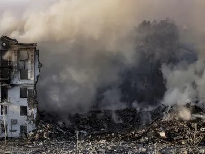 Smoke rises over a residential building destroyed by a Russian air strike on Kramatorsk, Ukraine, on Thursday, July 31, 2025. (AP Photo/Yevhen Titov)
