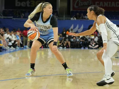 CHICAGO, IL - AUGUST 01: Veronica Burton #22 of the Golden State Valkyries guards Rachel Banham #24 of the Chicago Sky during the first half on August 1, 2025 at Wintrust Arena in Chicago, Illinois.,Image: 1027230216, License: Rights-managed, Restrictions:, Model Release: no