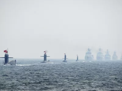 Chinese Navy submarines and warships take part in an international fleet review to celebrate the 60th anniversary of the founding of the People's Liberation Army Navy in Qingdao, Shandong province, in this April 23, 2009 file photo. To match Special Report BREAKOUT-SUBMARINES/   REUTERS/Guang Niu/Pool/Files (CHINA - Tags: MILITARY POLITICS ANNIVERSARY)