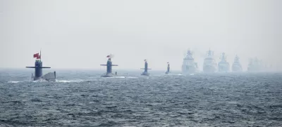 Chinese Navy submarines and warships take part in an international fleet review to celebrate the 60th anniversary of the founding of the People's Liberation Army Navy in Qingdao, Shandong province, in this April 23, 2009 file photo. To match Special Report BREAKOUT-SUBMARINES/   REUTERS/Guang Niu/Pool/Files (CHINA - Tags: MILITARY POLITICS ANNIVERSARY)