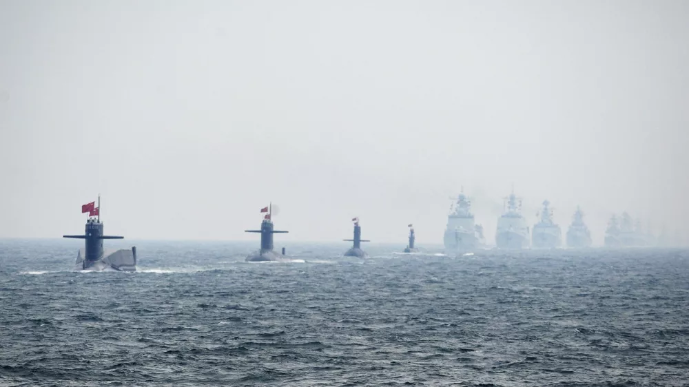 Chinese Navy submarines and warships take part in an international fleet review to celebrate the 60th anniversary of the founding of the People's Liberation Army Navy in Qingdao, Shandong province, in this April 23, 2009 file photo. To match Special Report BREAKOUT-SUBMARINES/   REUTERS/Guang Niu/Pool/Files (CHINA - Tags: MILITARY POLITICS ANNIVERSARY)