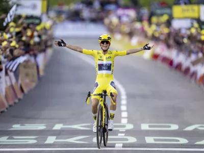 The winner of the Tour de France Femmes Pauline Ferrand-Prevot from France of team Visma - Lease a Bike celebrates as she crosses the finish line to win the 9th stage of the 4th edition of the Women's Tour de France cycling race, 124,1 km from Praz-Sur-Arly to Chatel Les Portes du Soleil, in Chatel, France, Sunday Aug. 3, 2025. (Jean-Christophe Bott/Keystone via AP)