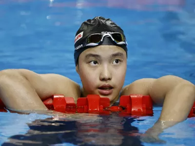 Swimming - World Aquatics Championships - Women 400m Medley - World Aquatics Championships Arena, Singapore - August 3, 2025 China's Zidi Yu reacts at the end of heat 2 REUTERS/Tingshu Wang