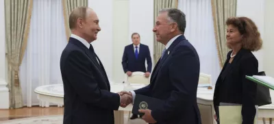 Russian President Vladimir Putin, left, and U.S. President Donald Trump's special envoy Steve Witkoff, right, shake hands during their meeting at the Kremlin in Moscow, Russia, Wednesday, Aug. 6, 2025. (Gavriil Grigorov, Sputnik, Kremlin Pool Photo via AP)
