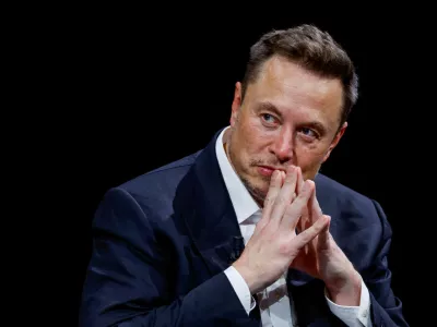 FILE PHOTO: FILE PHOTO: Elon Musk, Chief Executive Officer of SpaceX and Tesla and owner of Twitter, gestures as he attends the Viva Technology conference dedicated to innovation and startups at the Porte de Versailles exhibition centre in Paris, France, June 16, 2023. REUTERS/Gonzalo Fuentes/File Photo/File Photo