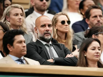Pep Guardiola seated with his wife Cristina and his daughter Maria in the royal box on day six of the 2024 Wimbledon Championships at the All England Lawn Tennis and Croquet Club, London. Picture date: Saturday July 6, 2024.,Image: 887741026, License: Rights-managed, Restrictions: Editorial use only. No commercial use without prior written consent of the AELTC. Still image use only - no moving images to emulate broadcast. No superimposing or removal of sponsor/ad logos., Model Release: no