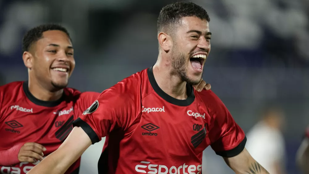 FILE - Rom&ucirc;lo of Brazil's Athletico Paranaense, right, celebrates scoring his side's opening goal against Paraguay's Libertad during a Copa Libertadores Group G soccer match at Defensores del Chaco stadium in Asuncion, Paraguay, Thursday, May 4, 2023. (AP Photo/Jorge Saenz, file)