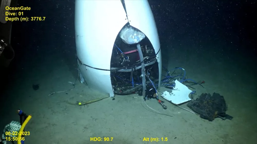 FILE PHOTO: Footage from a remotely operated vehicle shows, what the Coast Guard Marine Board of Investigation says is the debris of the Titan submersible that imploded while diving to the wreck of the Titanic, on the seafloor, September 17, 2024, in this still image from video. U.S. Coast Guard video courtesy of Pelagic Research Services/Handout via REUTERS  THIS IMAGE HAS BEEN SUPPLIED BY A THIRD PARTY/File Photo