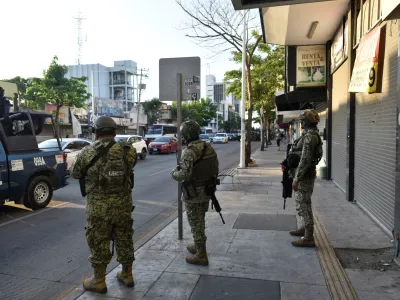 Members of the federal forces operate near a business closed and put up for rent, as violence and economic turmoil escalate in Culiacan one year after the abduction and extradition of Sinaloa Cartel leader Ismael "El Mayo" Zambada to the United States, in Culiacan, Sinaloa state, Mexico, July 24, 2025. REUTERS/Fernando Brito