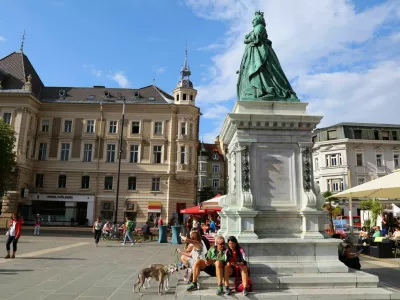 People visit empress Maria Theresia monument at Neuer Platz town square in Klagenfurt, Austria. Klagenfurt is the 6th largest city in Austria.