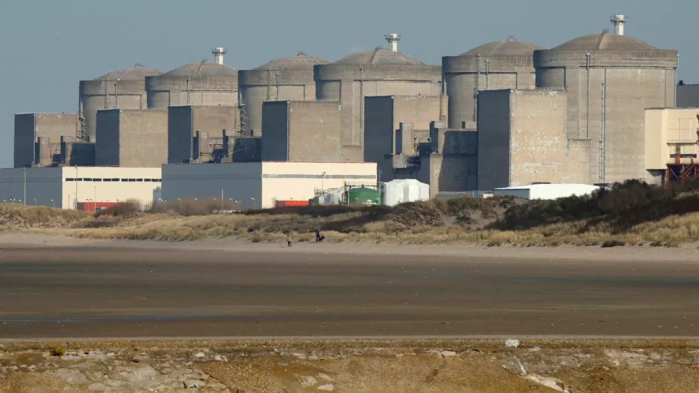 FILE PHOTO: The Gravelines nuclear power plant is seen across the beach in Petit Fort Philippe, northern France, March 10, 2017. REUTERS/Pascal Rossignol/File Photo