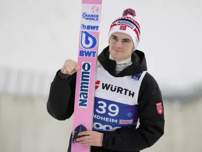 FILE - Marius Lindvik, of Norway, poses after winning the silver medal in the ski jumping men's large hill individual competition at the Nordic World Ski Championships in Trondheim, Norway, March 8, 2025. (AP Photo/Matthias Schrader, file)