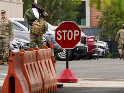 National Guard troops arrive at the District of Columbia National Guard Headquarters, Tuesday, Aug. 12, 2025, in Washington. (AP Photo/Julia Demaree Nikhinson)