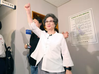 Choi Mal-ja (C), who was convicted 61 years ago for biting off the tongue of her attempted rapist, reacts after her retrial hearing at the Busan District Court in Busan on July 23, 2025. A South Korean court reopened a decades-old case on July 23, after the country's #MeToo movement inspired a woman to challenge her conviction for defending herself against sexual violence 61 years ago.,Image: 1024835661, License: Rights-managed, Restrictions: - South Korea OUT / NO ARCHIVES - RESTRICTED TO SUBSCRIPTION USE, Model Release: no