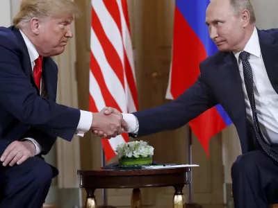 FILE - President Donald Trump, left, and Russian President Vladimir Putin shake hands at the beginning of a meeting at the Presidential Palace in Helsinki, Finland, July 16, 2018. (AP Photo/Pablo Martinez Monsivais, File)