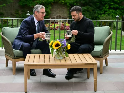 Britain's Prime Minister Keir Starmer, left, talks with Ukraine's President Volodymyr Zelenskyy in the garden of 10 Downing Street in London, Thursday Aug. 14, 2025. (Ben Stansall/Pool Photo via AP)