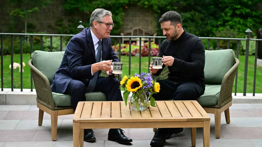 Britain's Prime Minister Keir Starmer, left, talks with Ukraine's President Volodymyr Zelenskyy in the garden of 10 Downing Street in London, Thursday Aug. 14, 2025. (Ben Stansall/Pool Photo via AP)