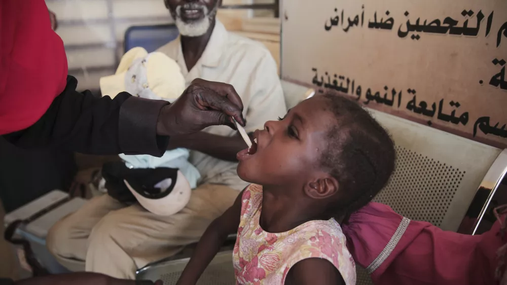 A Sudanese girl receives an oral cholera vaccine during a 10-day vaccination campaign conducted by health ministry workers in Khartoum, Sudan, Wednesday, Aug. 13, 2025. (AP Photo/Marwan Ali)