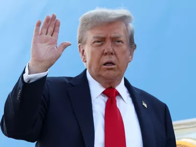 U.S. President Donald Trump waves while boarding Air Force One, as he departs for Alaska to meet with Russian President Vladimir Putin to negotiate for an end to the war in Ukraine, from Joint Base Andrews in Maryland, U.S., August 15, 2025. REUTERS/Kevin Lamarque