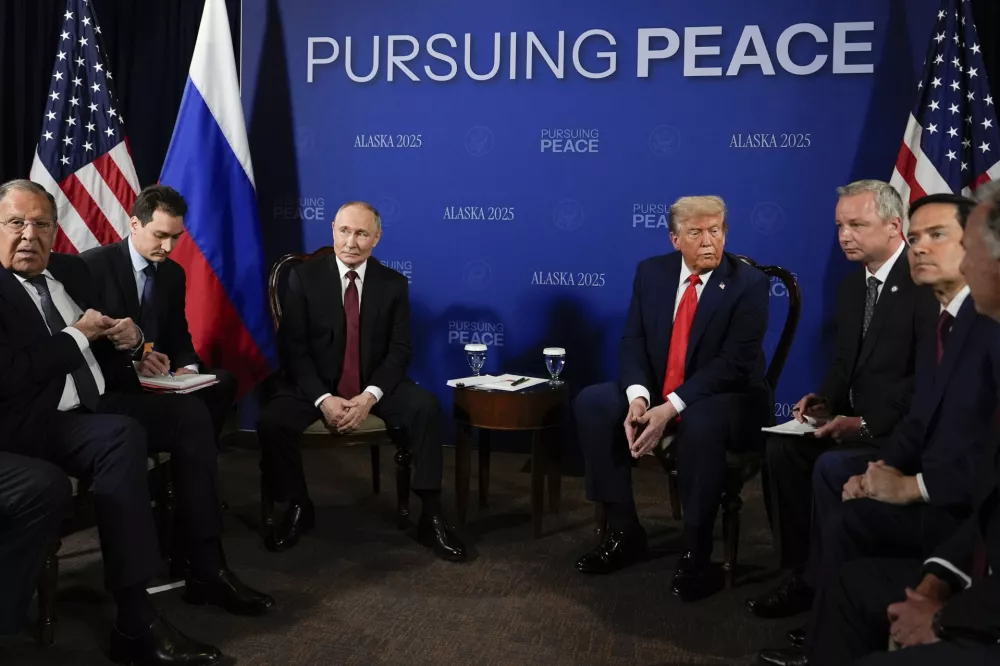 President Donald Trump meets with Russia's President Vladimir Putin Friday, Aug. 15, 2025, at Joint Base Elmendorf-Richardson, Alaska. At left is Russia's Foreign Minister Sergey Lavrov and second from right is Secretary of State Marco Rubio. (AP Photo/Julia Demaree Nikhinson)