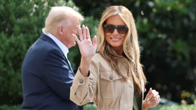 FILE PHOTO: First lady Melania Trump waves as she walks with U.S. President Donald Trump before they depart for travel to Texas to tour areas affected by deadly flash flooding, from the South Lawn of the White House in Washington, D.C., U.S., July 11, 2025. REUTERS/Jonathan Ernst/File Photo