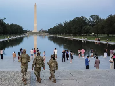 Members of the District of Columbia National Guard patrol along the National Mall, Saturday, Aug. 16, 2025, in Washington. (AP Photo/Julia Demaree Nikhinson)