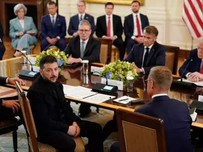 Ukrainian President Volodymyr Zelenskiy speaks during a meeting with U.S. President Donald Trump, French President Emmanuel Macron, British Prime Minister Keir Starmer, and Finland's President Alexander Stubb amid negotiations to end the Russian war in Ukraine, at the White House in Washington, D.C., U.S., August 18, 2025. REUTERS/Al Drago