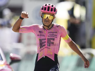 Ecuador's Richard Carapaz celebrates as he crosses the finish line to win the seventeenth stage of the Tour de France cycling race over 177.8 kilometers (110.5 miles) with start in Saint-Paul-Trois-Chateaux and finish in Superdevoluy, France, Wednesday, July 17, 2024. (AP Photo/Daniel Cole)
