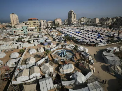 Palestinians displaced by the Israeli military offensive, shelter in tents, in Gaza City May 11, 2025. REUTERS/Dawoud Abu Alkas