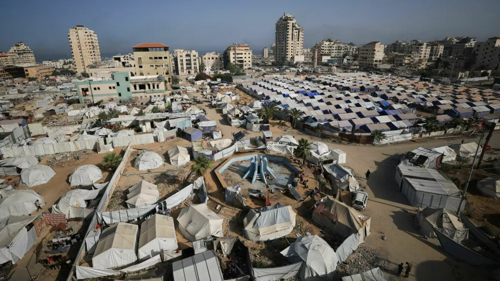 Palestinians displaced by the Israeli military offensive, shelter in tents, in Gaza City May 11, 2025. REUTERS/Dawoud Abu Alkas
