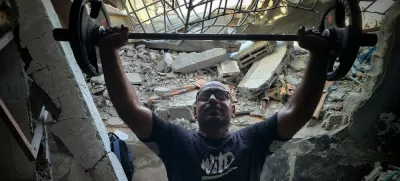 KHAN YUNIS, GAZA - JULY 21: A Palestinian man weightlifts in a gym, which has been damaged due to Israeli attacks, as Palestinian people try to exercise with limited opportunities of bodybuilding equipment in Khan Yunis, Gaza on July 21, 2024. Hani Alshaer / Anadolu,Image: 891889870, License: Rights-managed, Restrictions:, Model Release: no