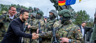 Ukrainian President Volodymyr Zelenskiy interacts with soldiers during his visit to a military training area to find out about the training of Ukrainian soldiers on the ?Patriot? anti-aircraft missile system, at an undisclosed location, in Germany, June 11, 2024.  Jens Buttner/Pool via REUTERS/File Photo