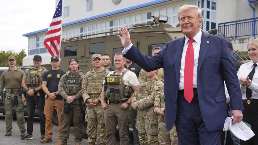 President Donald Trump speaks with members of law enforcement and National Guard soldiers, Thursday, Aug. 21, 2025, in Washington. (AP Photo/Jacquelyn Martin)
