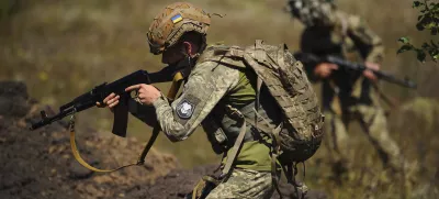 In this photo, taken on Tuesday, Aug. 19, 2025 and provided by Ukraine's 127th Separate Brigade of the Territorial Defence press service, soldiers aged 18 to 24 practice military skills on a training ground near Kharkiv, Ukraine. (Anatolii Lysianskyi/Ukraine's 127th Separate Brigade via AP)
