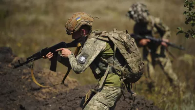 In this photo, taken on Tuesday, Aug. 19, 2025 and provided by Ukraine's 127th Separate Brigade of the Territorial Defence press service, soldiers aged 18 to 24 practice military skills on a training ground near Kharkiv, Ukraine. (Anatolii Lysianskyi/Ukraine's 127th Separate Brigade via AP)