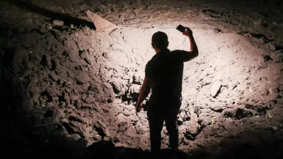 21 August 2025, Russia, Donetsk: A view of a crater on private property after a drone attack by the Armed Forces of Ukraine on Kirovsky neighbourhood. Photo: Dmitry Yagodkin/TASS via ZUMA Press/dpa