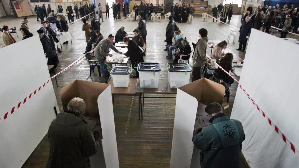 Voters cast their ballots at a polling station in Pristina, Kosovo, Saturday, Nov. 17, 2007. Kosovo's voters were choosing a new parliament Saturday they hope will deliver independence from Serbia.(AP Photo/Darko Bandic)
