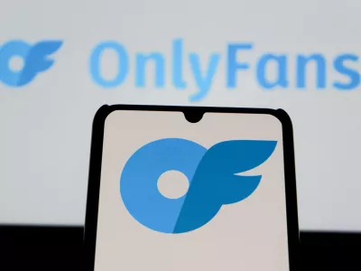 August 12, 2025, Indonesia: In this photo illustration, the OnlyFans logo is seen displayed on a mobile phone and in the background.,Image: 1028930566, License: Rights-managed, Restrictions:, Model Release: no