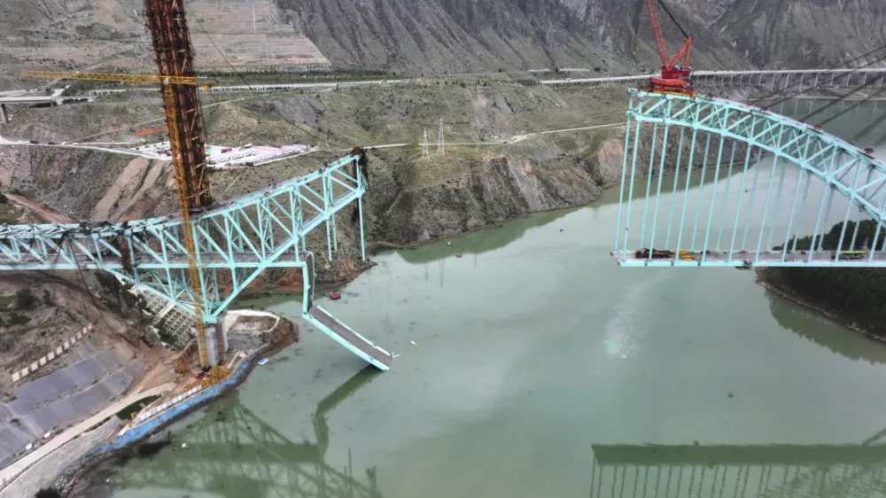 This aerial photo released by Xinhua News Agency shows the site of an under construction bridge that collapsed on the Qinghai section of the Sichuan-Qinghai Railway causing multiple dead and missing, in northwest China's Qinghai Province on Friday, Aug. 22, 2025. (Li Zhanyi/Xinhua via AP)