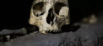 A skull is pictured inside the catacomb of Priscilla in Rome November 19, 2013. The catacomb, used for Christian burials from the late 2nd century through the 4th century, reopened on Tuesday to the public after years of restoration. The complex will also be viewable in a dedicated section of Google Maps, according to a Vatican press release. REUTERS/Max Rossi (ITALY - Tags: SOCIETY TRAVEL)