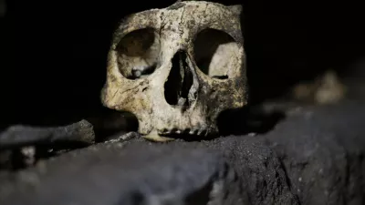 A skull is pictured inside the catacomb of Priscilla in Rome November 19, 2013. The catacomb, used for Christian burials from the late 2nd century through the 4th century, reopened on Tuesday to the public after years of restoration. The complex will also be viewable in a dedicated section of Google Maps, according to a Vatican press release. REUTERS/Max Rossi (ITALY - Tags: SOCIETY TRAVEL)